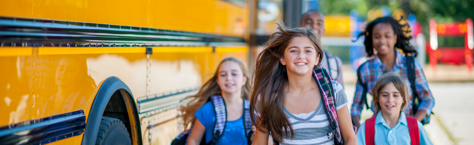 Students beside school bus